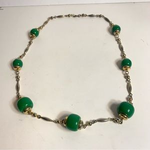 Vintage necklace with green plastic beads and gold tone connectors